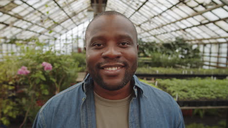 Portrait-of-Positive-African-American-Man-in-Greenhouse